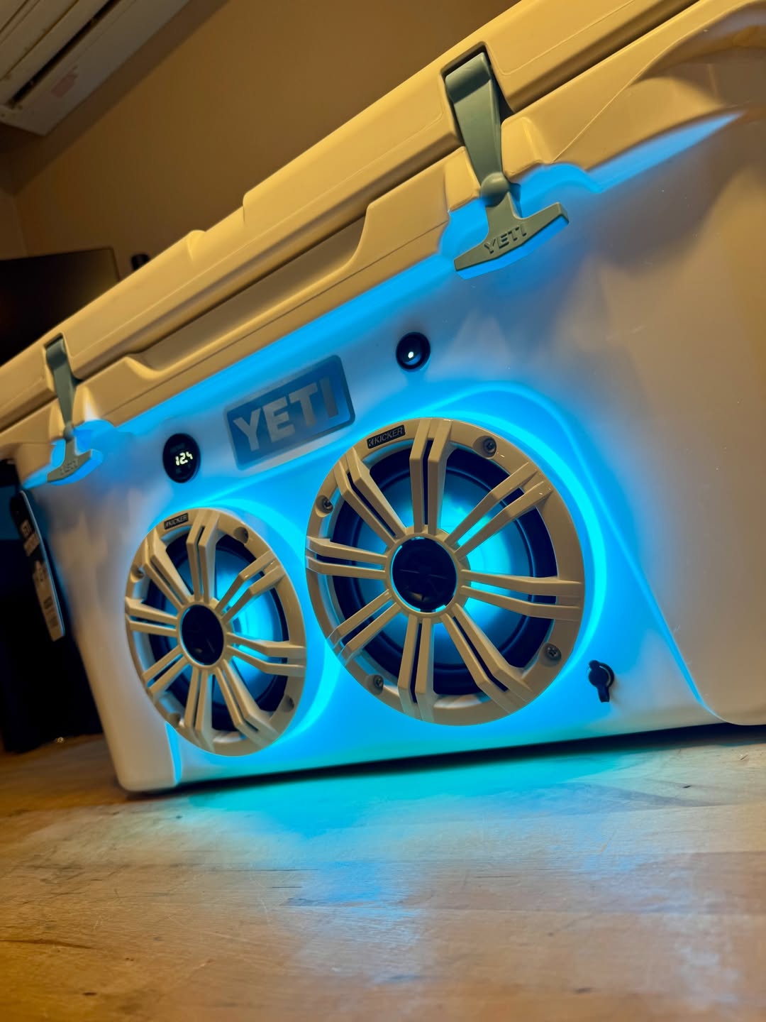 white yeti cooler with built in speakers and led lights