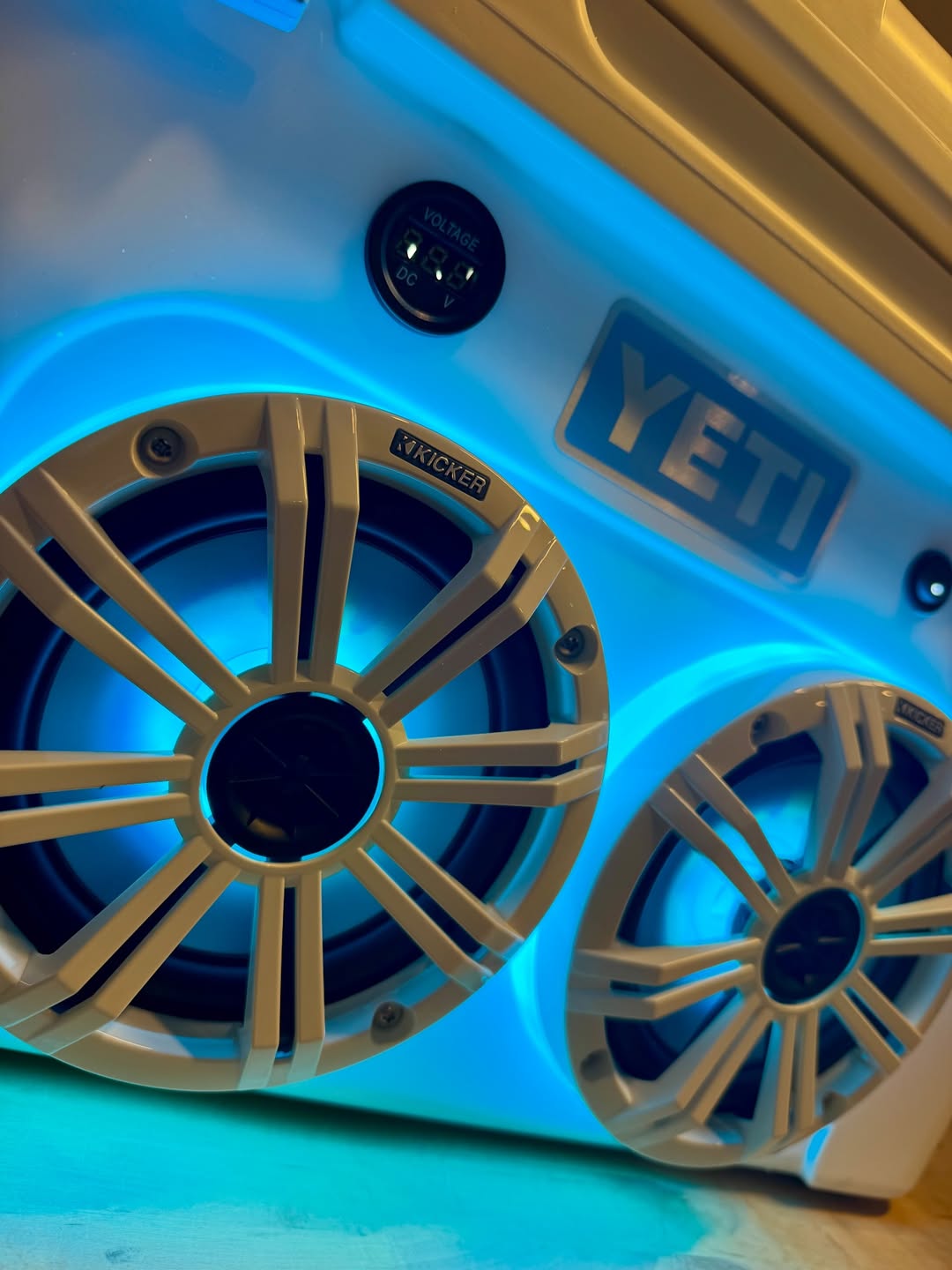 white yeti cooler with built in speakers and led lights